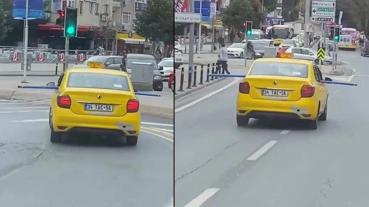 Trafikte tehlikeli anlar: Metrelerce uzunluktaki boruyu aracıyla taşıdı