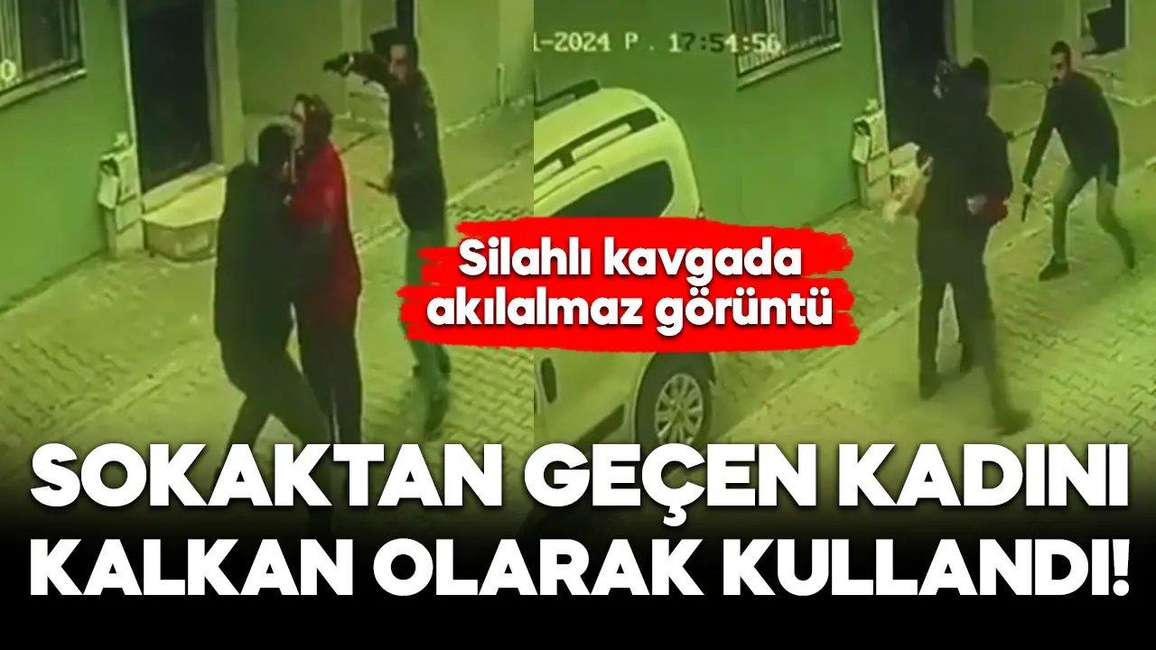 Sokaktan geçen kadını kavgada kalkan olarak kullandı!