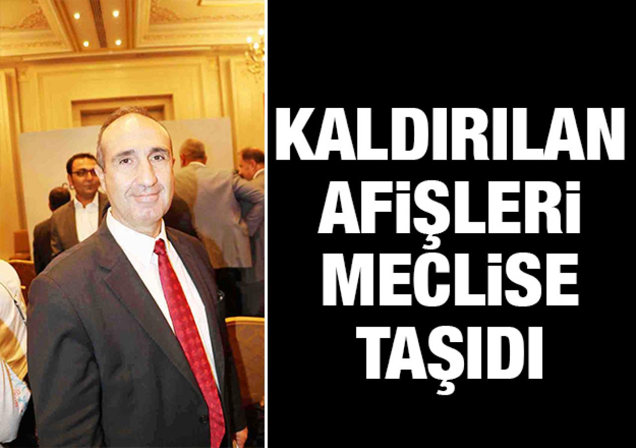 Kaldırılan afişleri meclise taşıdı