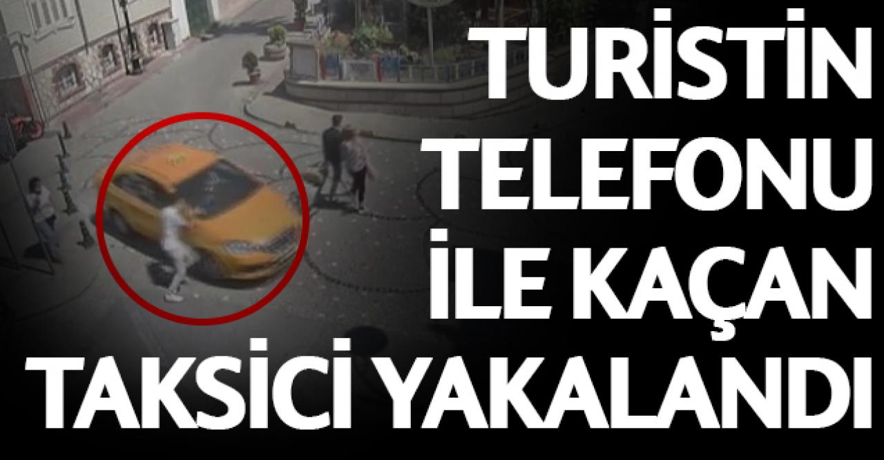 Turistin aracında unuttuğu telefonla kaçan taksici yakalandı