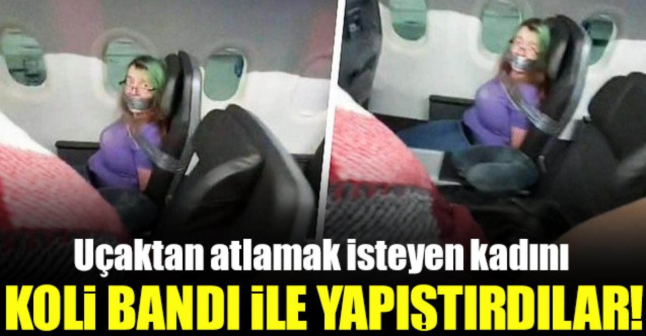 Uçaktan atlamak isteyen kadını koli bandı ile bağladılar