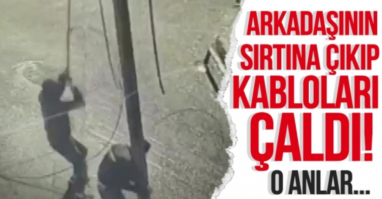 Arkadaşının sırtına çıkan hırsız elektrik kablolarını çaldı