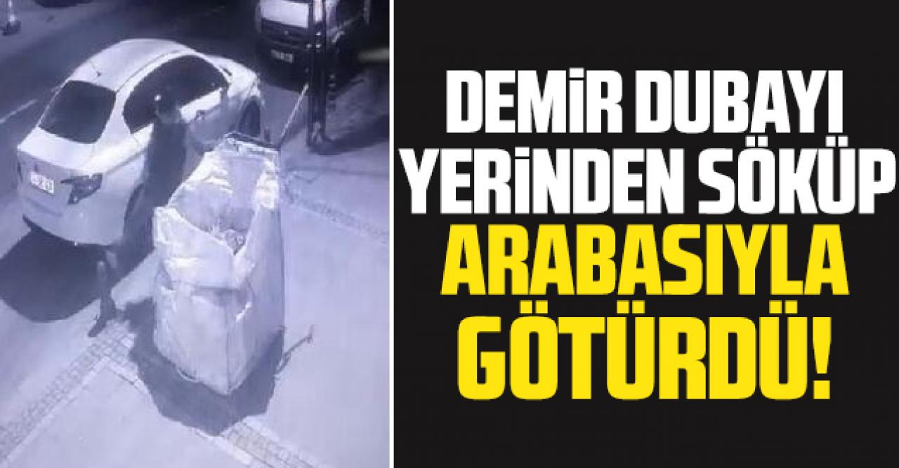 Kaldırımdaki demir dubayı söküp çekçek arabasıyla götürdü