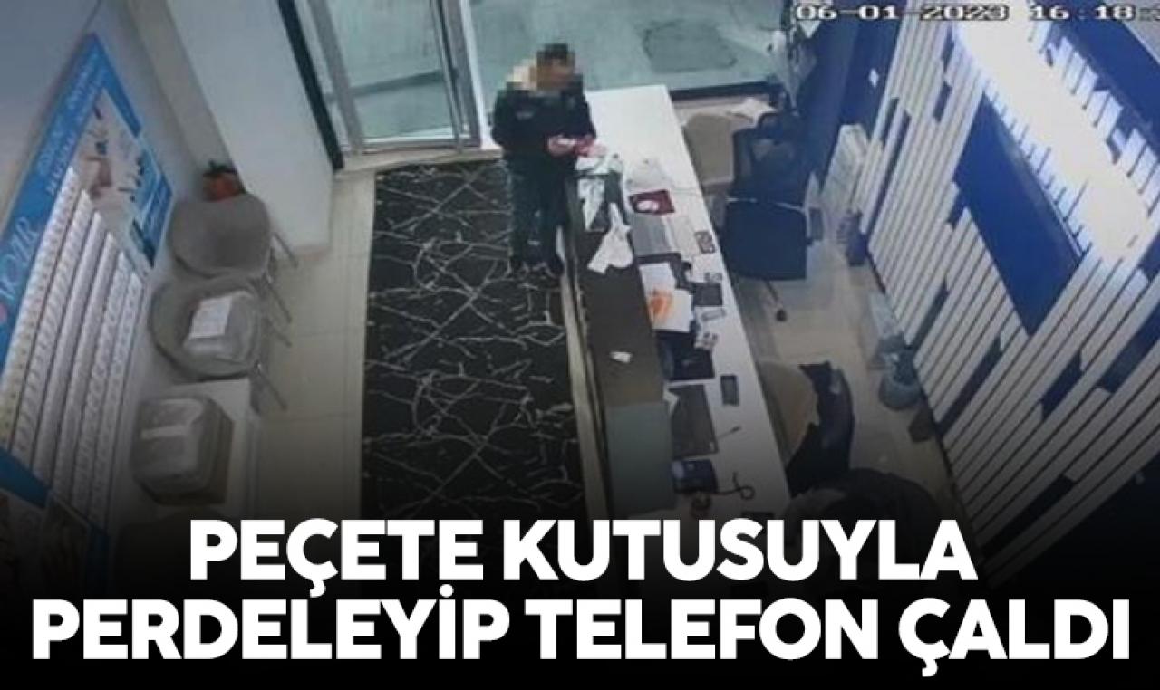 Peçete kutusu arkasından cep telefonu çalıp kaçtı