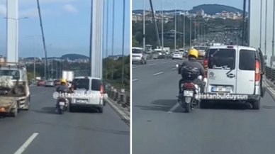 İstanbul'da trafikte tehlikeli görüntüler: Yolda kalan aracı motosikletli ayaklarıyla böyle itti