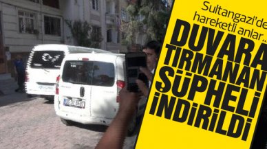 Sultangazi'de bina duvarındaki çıkıntıya tırmanan şüpheli indirildi