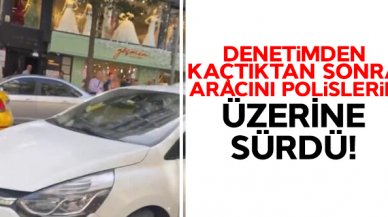 Şişli'de denetimden kaçan sürücünün, aracını polisin üzerine sürdüğü anlar kamerada