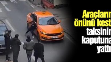 Beyoğlu'nda araçların önünü kesti, taksinin kaputunun üzerine yattı