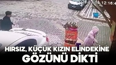 Hırsız şimdide küçük kızın elindekine göz dikti!