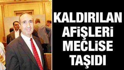 Kaldırılan afişleri meclise taşıdı