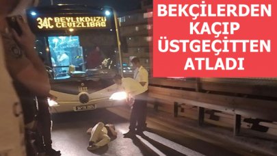 Bekçilerden kaçan şahıs metrobüs yoluna atladı