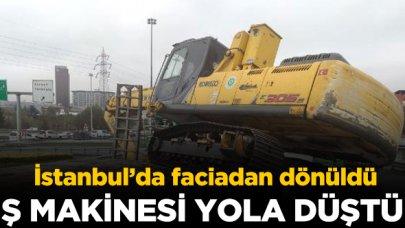 Basın Ekspres yolunda faciadan dönüldü! TIR'ın üzerinden iş makinesi düştü