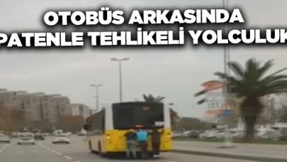 Gençlerin patenle tehlikeli otobüs arkası yolculuğu