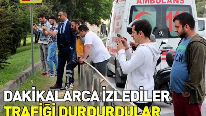 Ağaçta asılı kişiyi izleyen vatandaşlar trafiği kilitledi