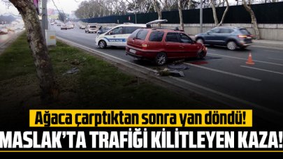 Maslak'ta ağaca çarpan araç yan döndü! Trafik kilitlendi