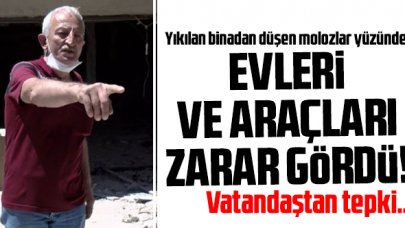 Yıkılan binadan düşen molozlar evlerine ve araçlarına zarar verdi!