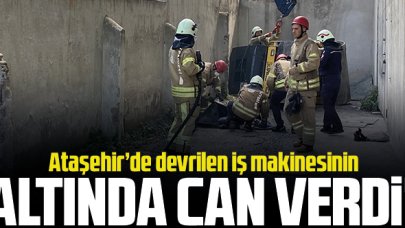 Devrilen iş makinesinin altında can verdi