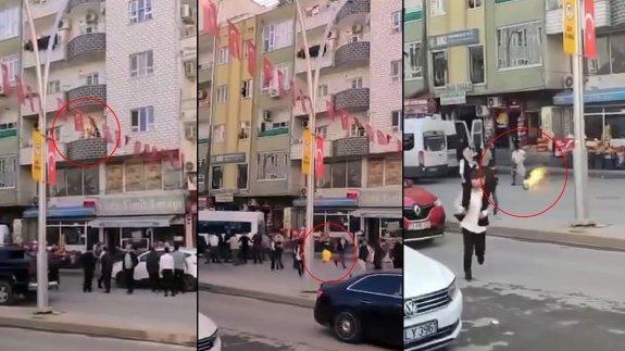 Panik anları: Alev alan tüpü, balkondan kalabalığın arasına attı